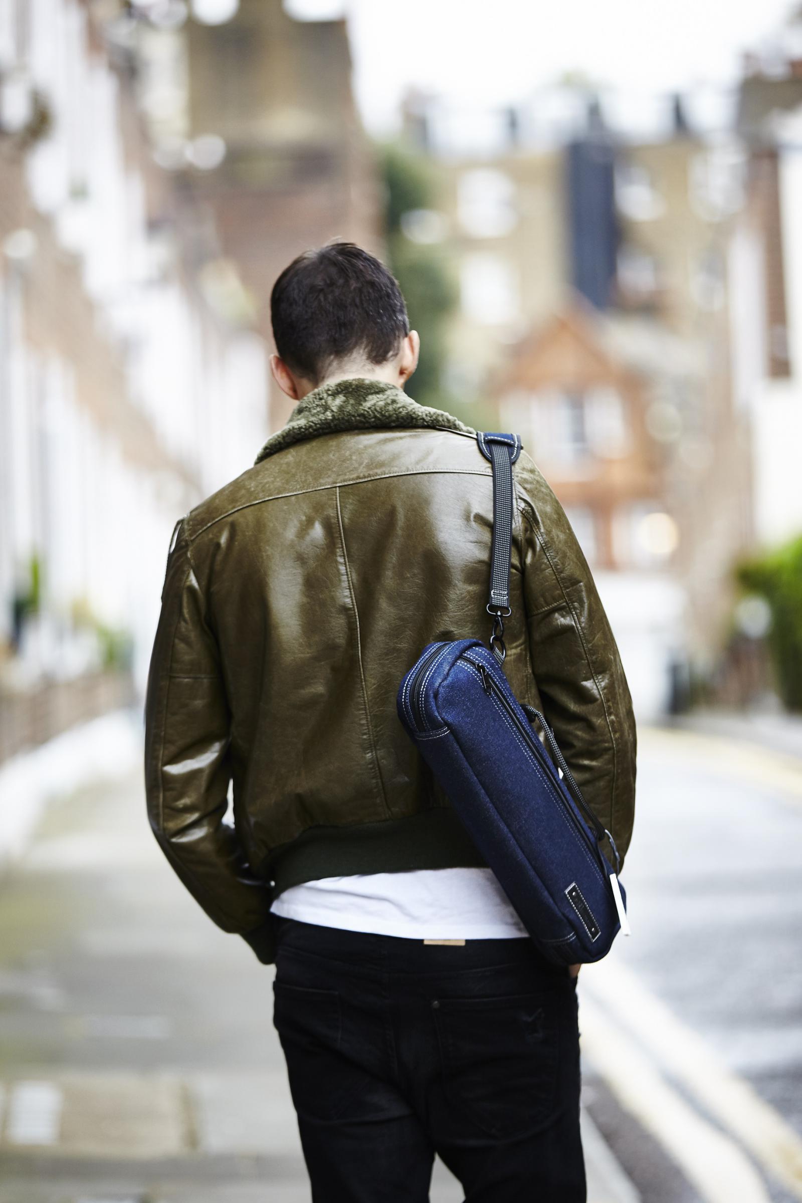 Man Carrying Denim Flute Bag